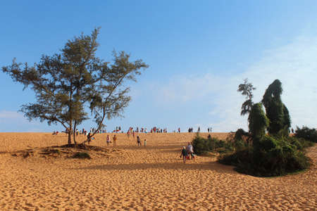 Mui Ne, Vietnam - June 27, 2017: Tourist walking around at red sand dunes in the morningのeditorial素材