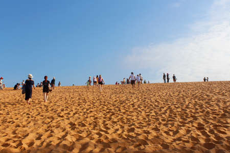 Mui Ne, Vietnam - June 27, 2017: Tourist walking around at red sand dunes in the morningのeditorial素材