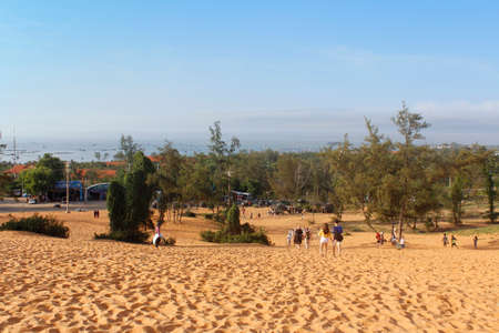 Mui Ne, Vietnam - June 27, 2017: Tourist walking around at red sand dunes in the morningのeditorial素材
