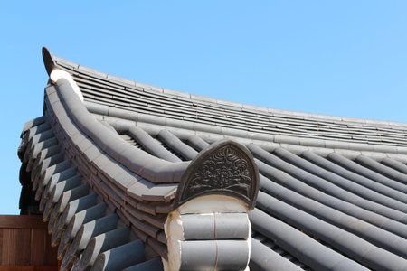 Korean traditional architecture detail of roof with flower image at Beomeosa Temple in Busan, South...
