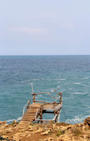 Scenic view of wooden bridge at Timang Beach in sunny day, Yogyakarta, Indonesiaの写真素材