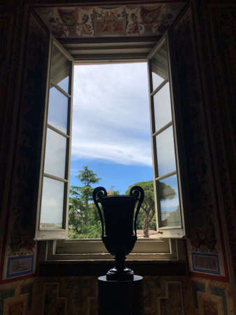 View through a window from the Vatican Museum with blue sky and cloudsのeditorial素材
