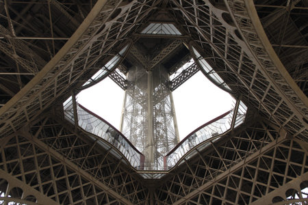 An Eiffel Tower detail view in cloudy day, Paris, France