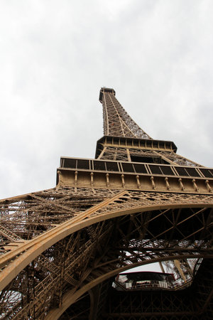 An Eiffel Tower detail view in cloudy day, Paris, France