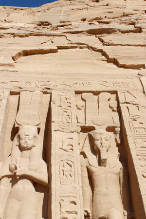 Colossal standing statues of Ramses and Nefertari at entrance of the Temple of Nefertari, Egypt