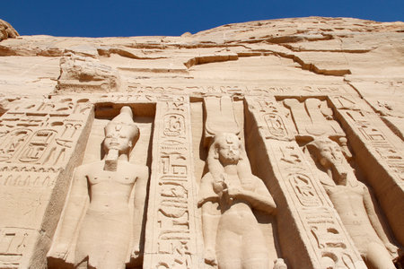 Colossal standing statues of Ramses and Nefertari at entrance of the Temple of Nefertari, Egyptの写真素材