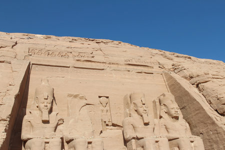 Four colossal statues of a seated Ramses II at entrance of the Great Temple of Abu Simbel, Egyptの写真素材
