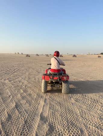 Quad bike adventure through the desert in a sunny afternoon at Hurghada, Egypt
