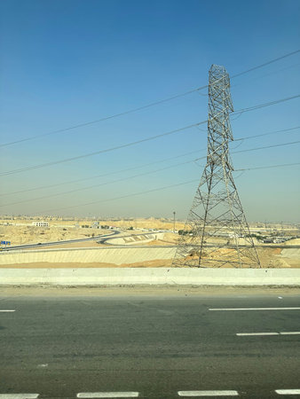 Desert scenery with the transmission tower on the road trip from Hurghada to Cairo