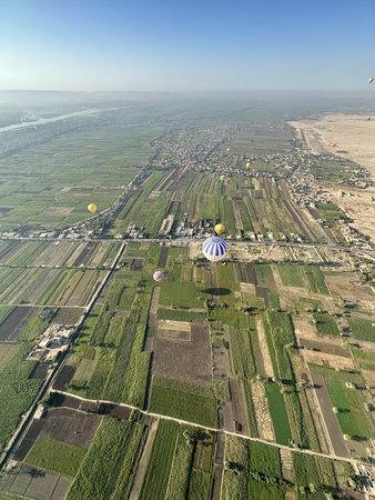 Aerial view of the crops on East bank with the hot air balloons in the morning, Egyptの写真素材
