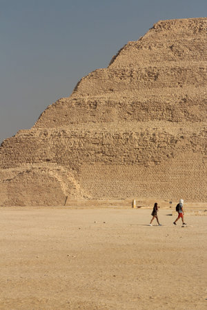 Step Pyramid of Djoser with tourists hanging around at Saqqara, Egypt