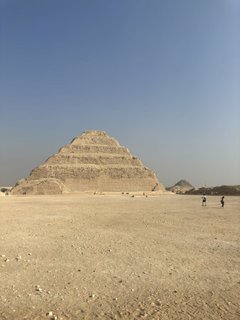Step Pyramid of Djoser with tourists hanging around at Saqqara, Egypt