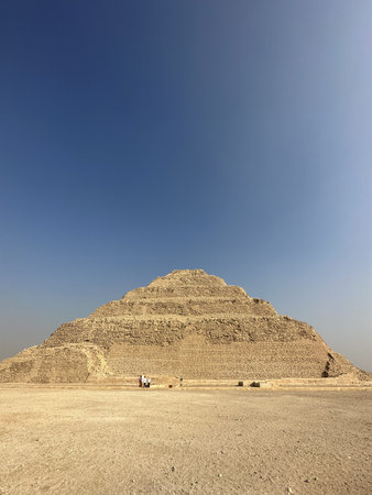 Step Pyramid of Djoser with tourists hanging around at Saqqara, Egypt