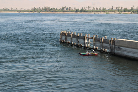 Fishermen in their rowing boat near the Esna Lock on the River Nile, Egypt