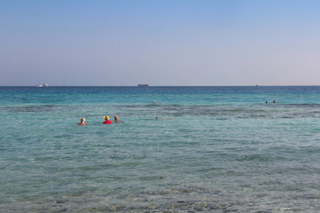 Red sea seascape with tourists swimming and snorkeling on a sunny day in Hurghada, Egyptの写真素材