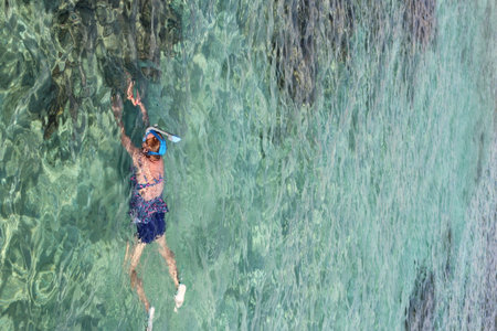 Woman snorkeling in the Red sea on a sunny day, Hurghada, Egyptの写真素材