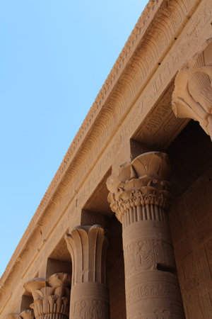 View of top column at Temple of Isis with lotus blossoms at Philae, Aswan, Egyptの写真素材