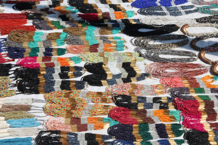 Traditional Egyptian accessories display on the white cloth for sales in Aswan, Egypt