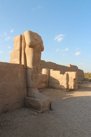 Headless colossal statue at the Easten Edge of Karnak Temple Complex, Luxor, Egypt