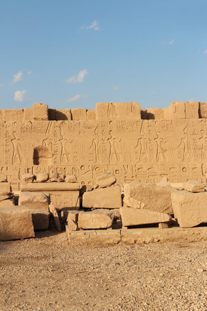 Wall bas-relief and ruins during sunset at Karnak Temple Complex, Luxor, Egypt