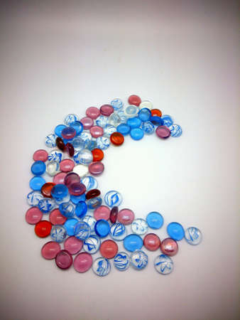 colorful pebbles forming letter cの素材