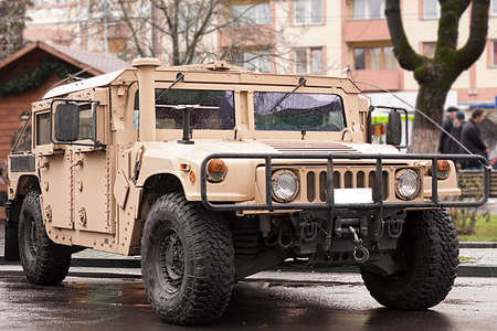 military troop transport vehicle parked near the sidewalkのeditorial素材