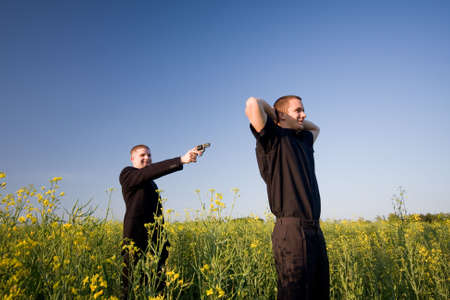 businessman point with gunの写真素材