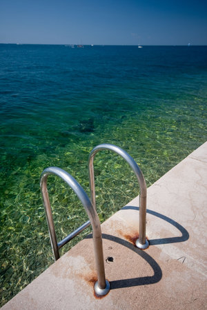 steel ladder ï¿½ down to the sea の写真素材