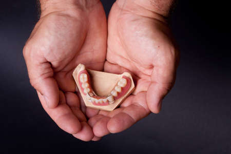 detail dental wax model in human palmの写真素材