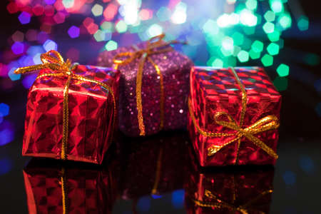 giftboxes with colorful shiny backgroundの写真素材