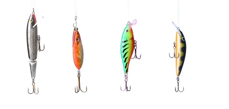 Five fishing lures -floating wobblers hanging in front of white backgroundの写真素材