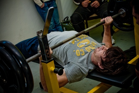 PECS - JANUARY 29: Unknown man participates in Amateur bench press championship in Professors GYM January 29, 2011 in Pecs, Hungary. のeditorial素材