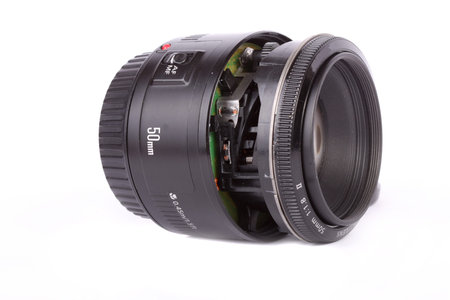 Broken lens on white background の写真素材