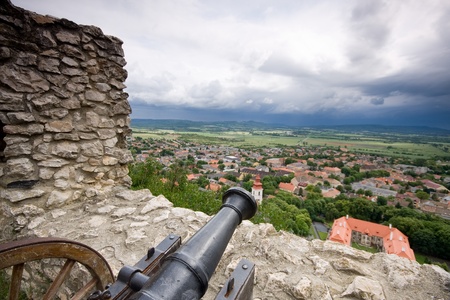 cannon in castle with cloudy skyの写真素材