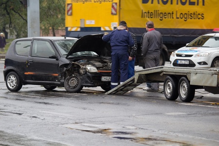 PECS, HUNGARY - OCT. 21: For car crashed. Repairmans try to help the victim of car accident on Oct 21, 2011 on Road 6 in Pecs, Hungary.のeditorial素材