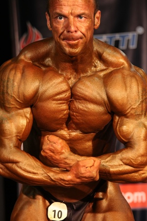 BUDAPEST - JUNY 18:Erno Reichardt participates in WABBA bodybuilding world championship Masters category Juny 18, 2011 in Budapest, Hungaryのeditorial素材