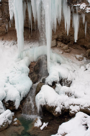 lots of icicles near riverの写真素材
