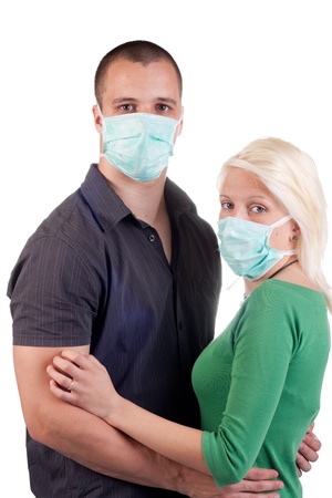 young people wearing flu masks over whiteの写真素材