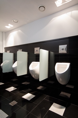 urinal man clean toilets in dark roomのeditorial素材