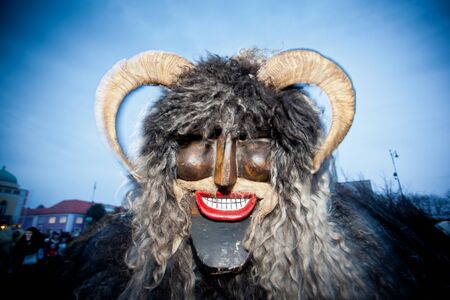 MOHACS, HUNGARY - FEBRUARY 12: Unidentified people in mask participants at the Mohacsi Busojaras, it is a carnival for spring greetings) February 12, 2013 in Mohacs, Hungary.のeditorial素材