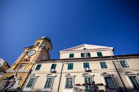 Yellow Clock Tower with Relief in Rijeka, Croatiaの写真素材
