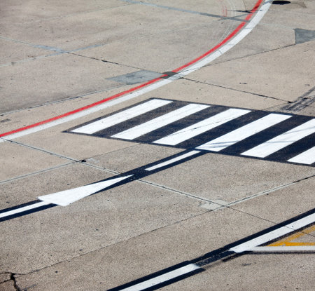 black and yellow airport markings on concrete