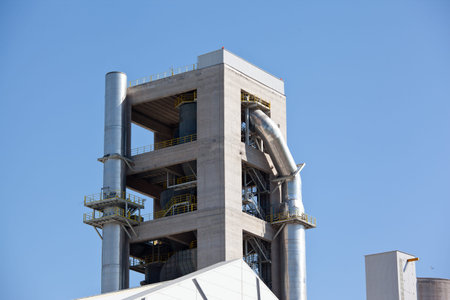 Cement factory machinery on a clear blue day