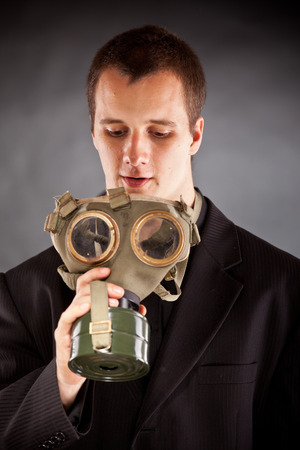 businessman with gas mask in studioの写真素材