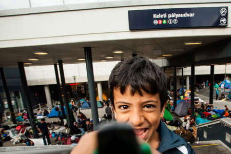 BUDAPEST - SEPTEMBER 4 : War refugees at the Keleti Railway Station on 4 September 2015 in Budapest, Hungary. Refugees are arriving constantly to Hungary on the way to Germany.のeditorial素材