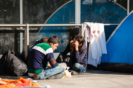 BUDAPEST - SEPTEMBER 7: war refugees waiting at Keleti Railway Station on 7 September 2015 in Budapest, Hungary. Refugees are arriving constantly to Hungary on the way to Germany.のeditorial素材