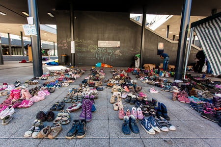 BUDAPEST - SEPTEMBER 7: child shoes for war refugees at Keleti Railway Station on 7 September 2015 in Budapest, Hungary. Refugees are arriving constantly to Hungary on the way to Germany.のeditorial素材