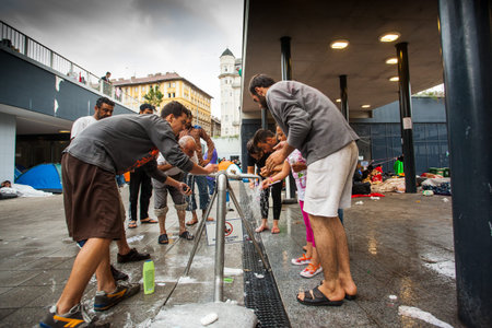 BUDAPEST - SEPTEMBER 4 : War refugees at the Keleti Railway Station on 4 September 2015 in Budapest, Hungary. Refugees are arriving constantly to Hungary on the way to Germany.のeditorial素材