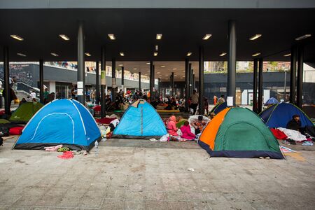 BUDAPEST - SEPTEMBER 4 : War refugees camp at the Keleti Railway Station on 4 September 2015 in Budapest, Hungary. Refugees are arriving constantly to Hungary on the way to Germany.のeditorial素材