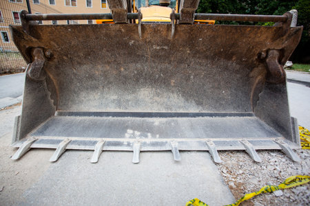 Excavator waitnig for work in a city